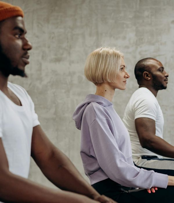 Woman performing a calm and focused cardio exercise indoors.